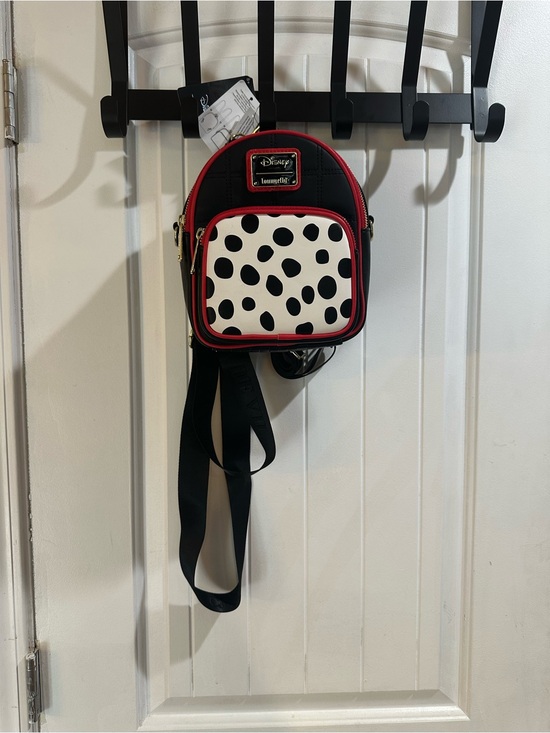 Loungefly Handbags - Loungefly Disney Cruella Convertible Mini Backpack -101 Dalmatian spots
